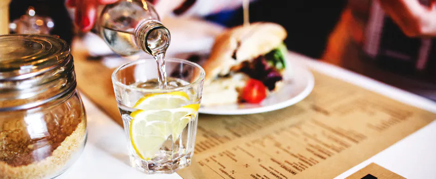 pouring water at meal time